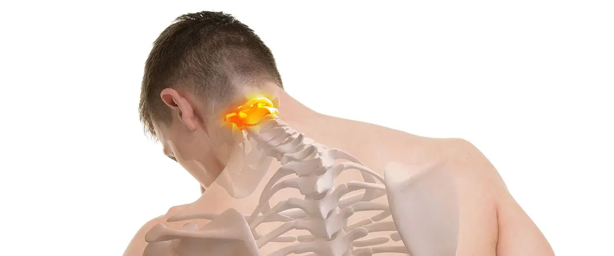 Physical Healthcare of Jacksonville provider evaluating a patient's upper cervical spine and atlas misalignment as part of a whole-body treatment approach